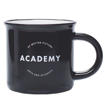 A glossy black ceramic mug with the ACADEMY logo printed on the side against a white background.